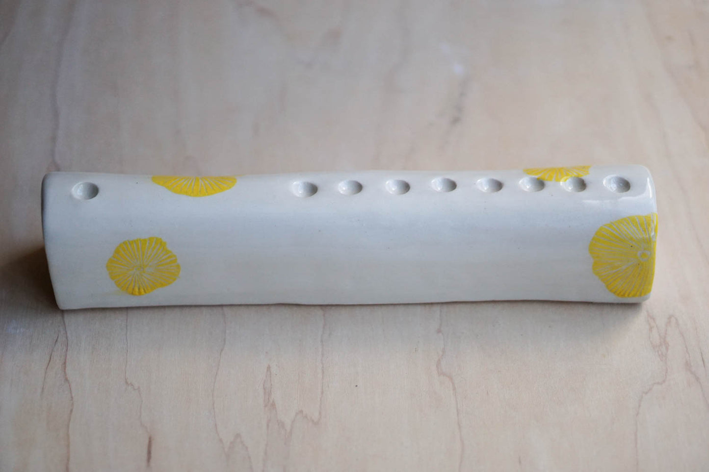 Menorah with yellow flowers