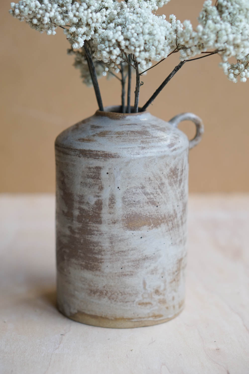 rustic handmade bottle vase with flowers