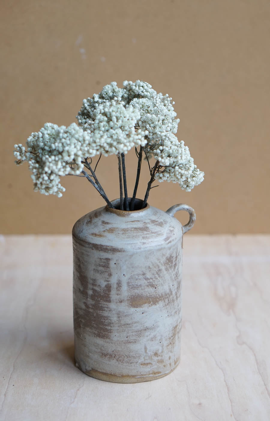 rustic handmade bottle vase with flowers