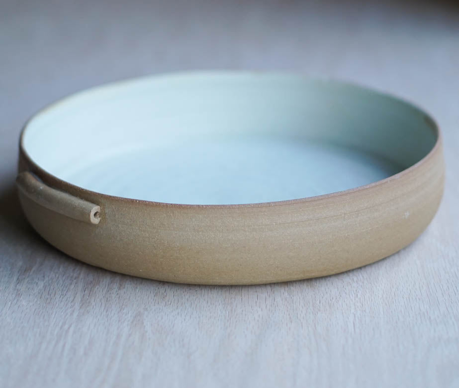 A bowl with handles