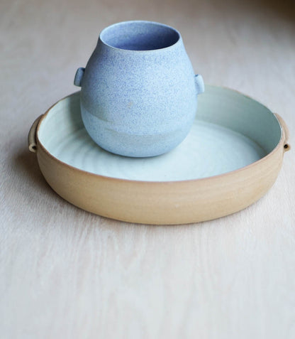 A bowl with handles