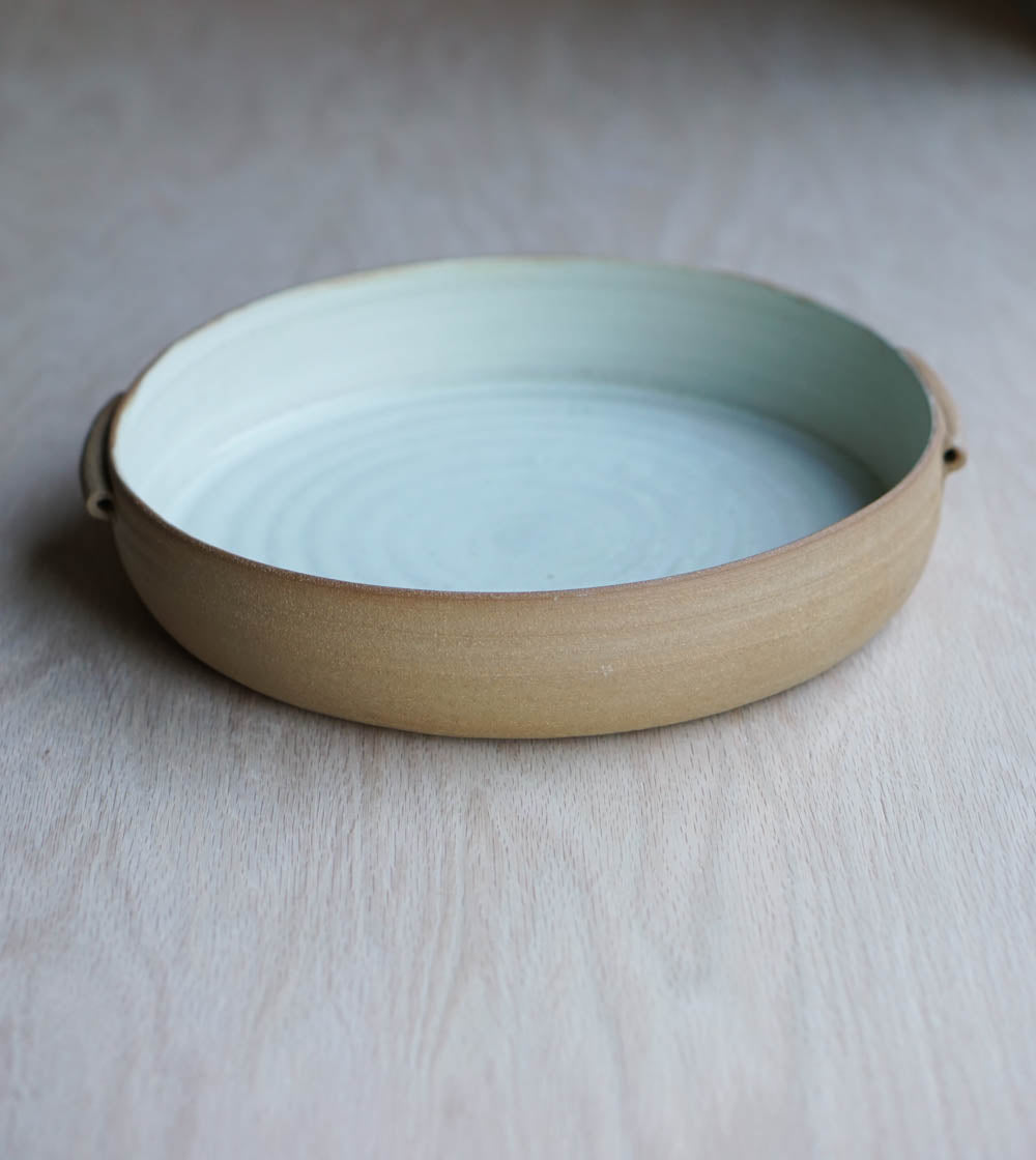 A bowl with handles