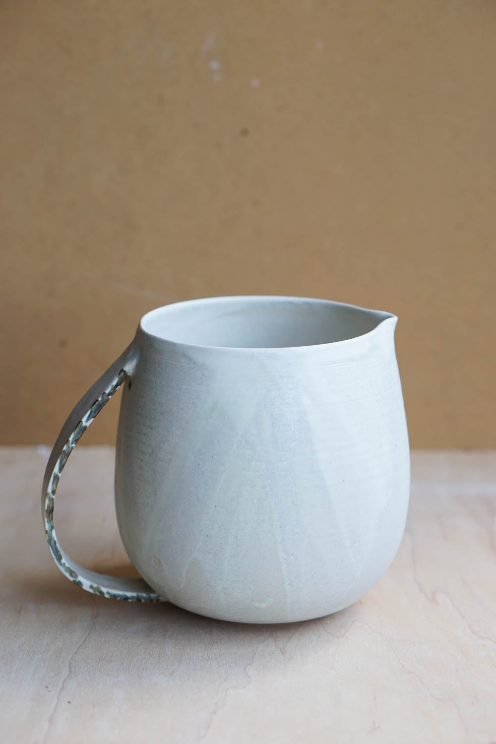 minimal design for handmade ceramics pitcher 
