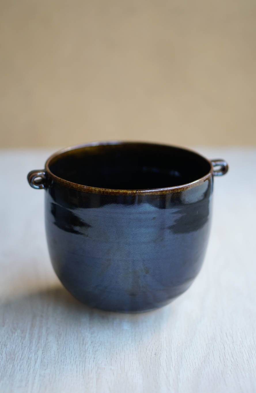 Glossy black vessel