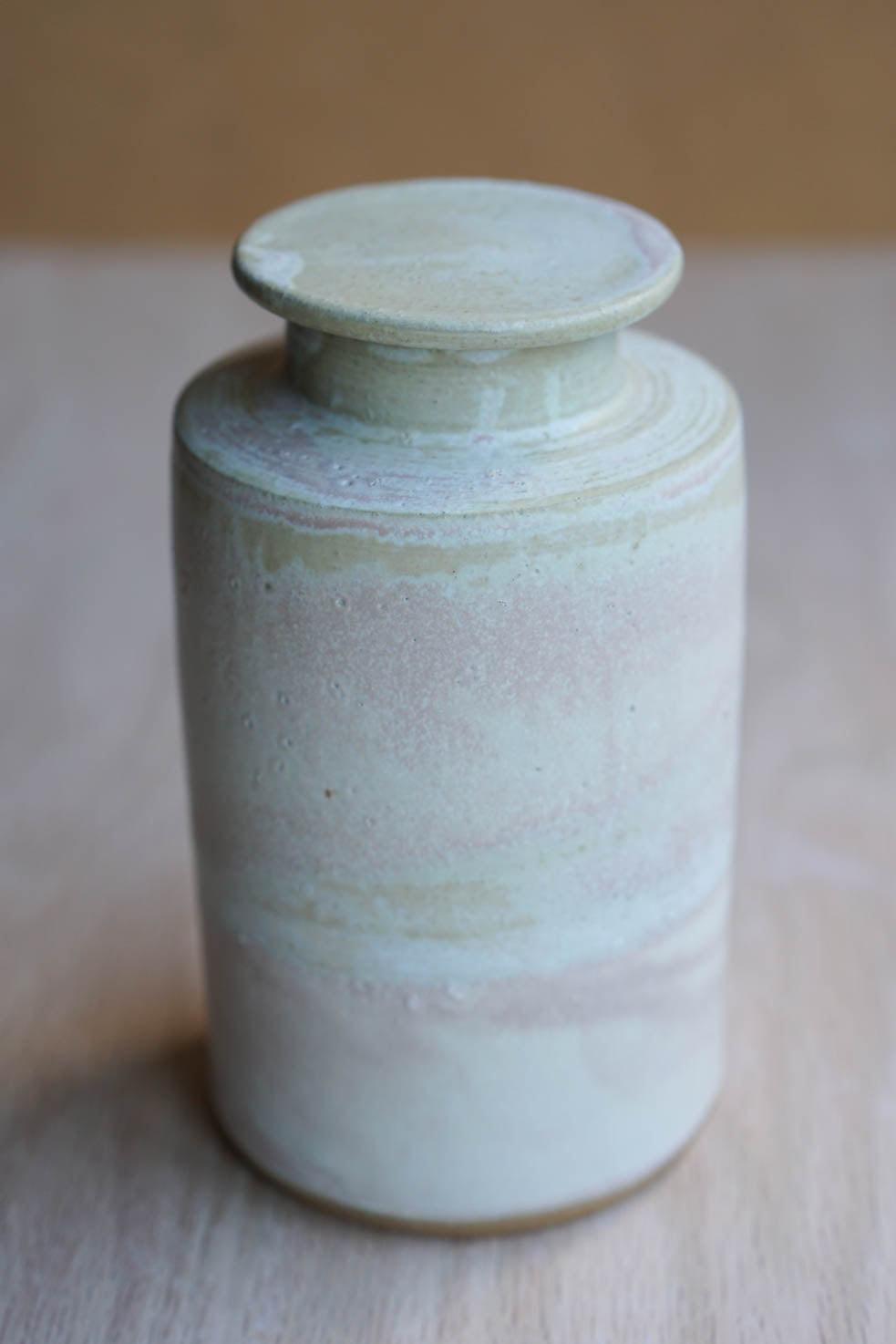 Lidded cloudy bottle