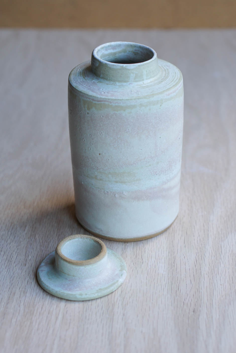 Lidded cloudy bottle