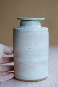 Lidded cloudy bottle