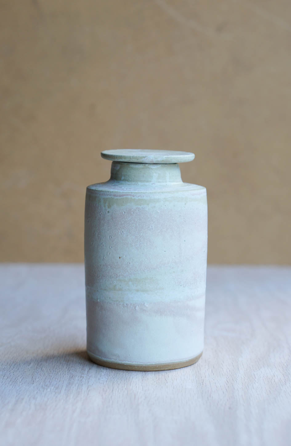 Lidded cloudy bottle