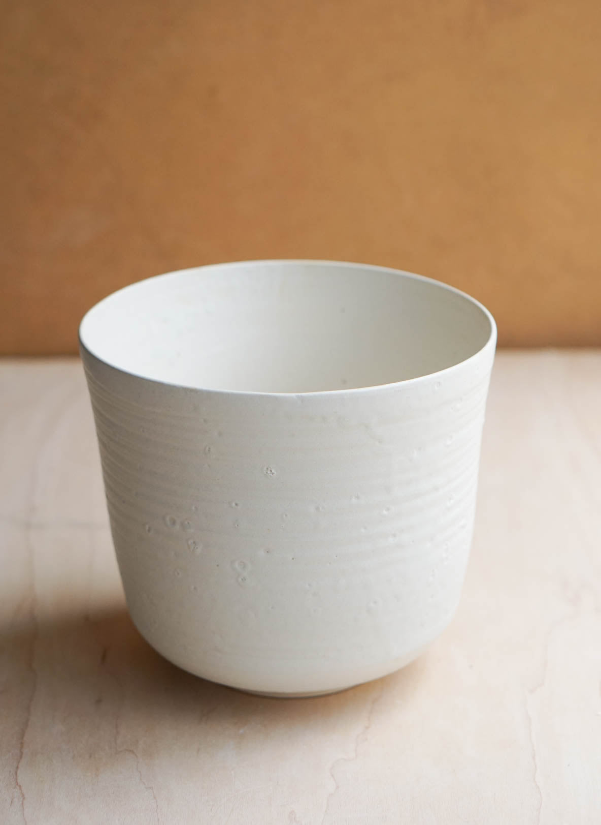 white bucket vase