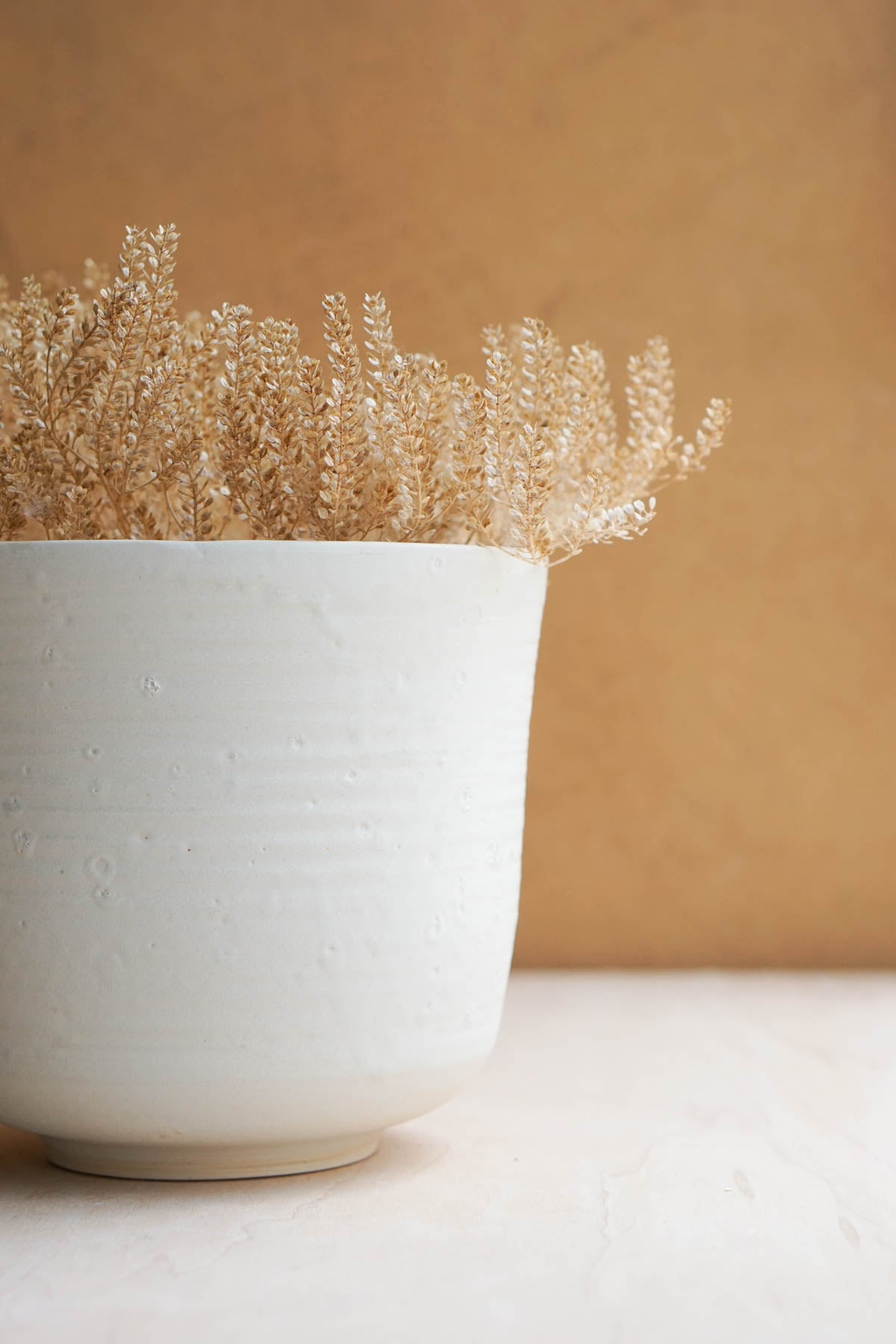 white bucket vase