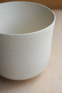 white bucket vase