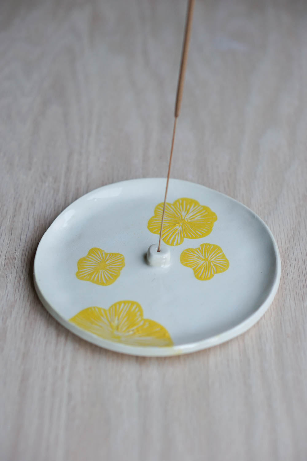 Yellow flower incense holder