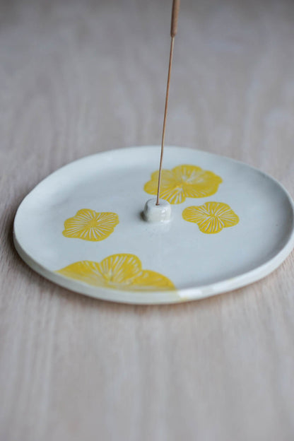 Yellow flower incense holder